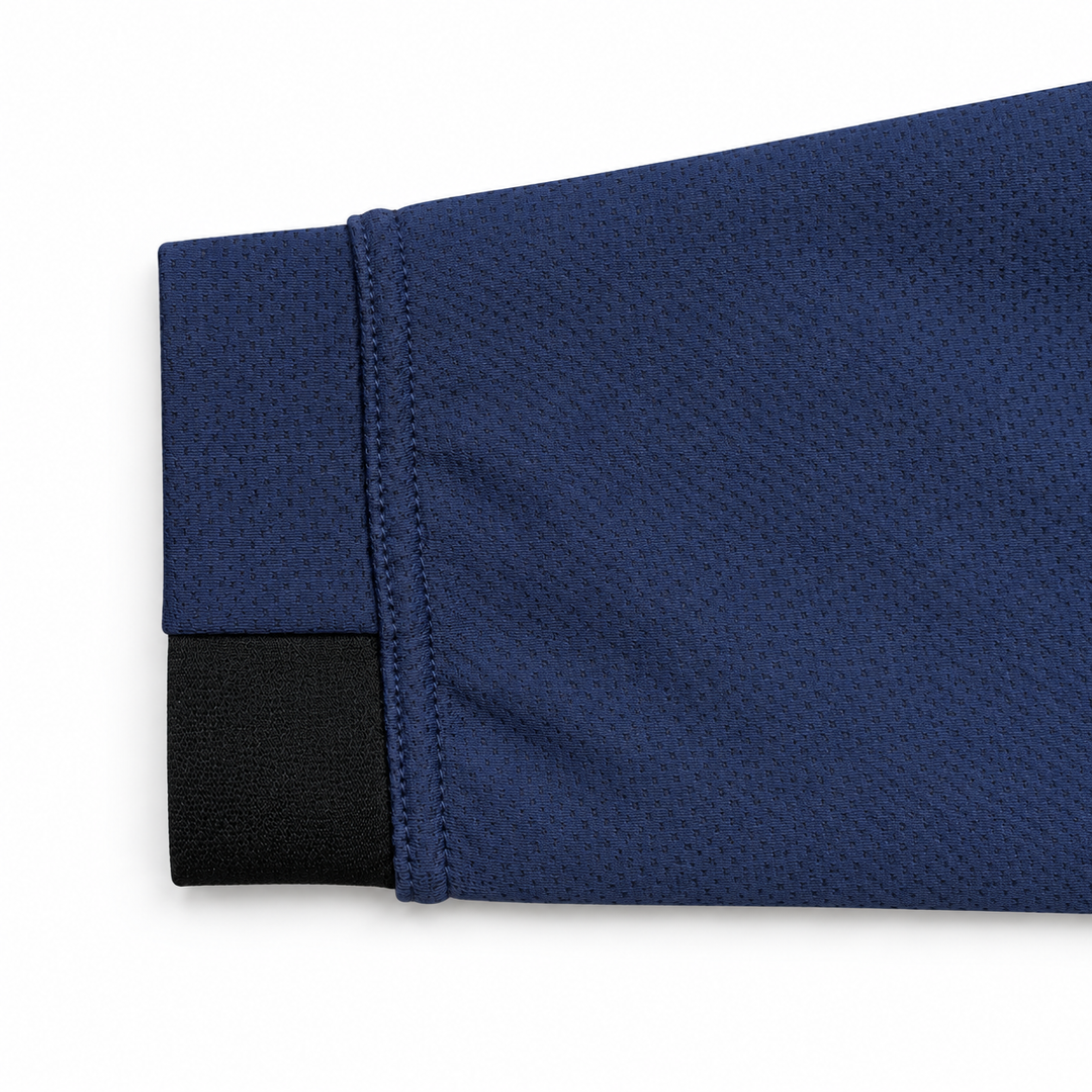 Close-up of the navy sleeve and black cuff accent on The Standard Crew