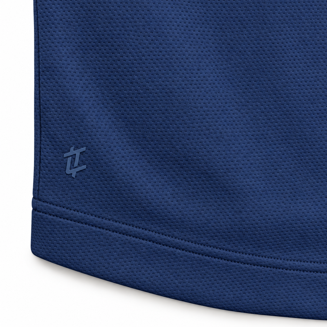 Close-up of the tonal logo and hem stitching on The Standard Crew in Navy