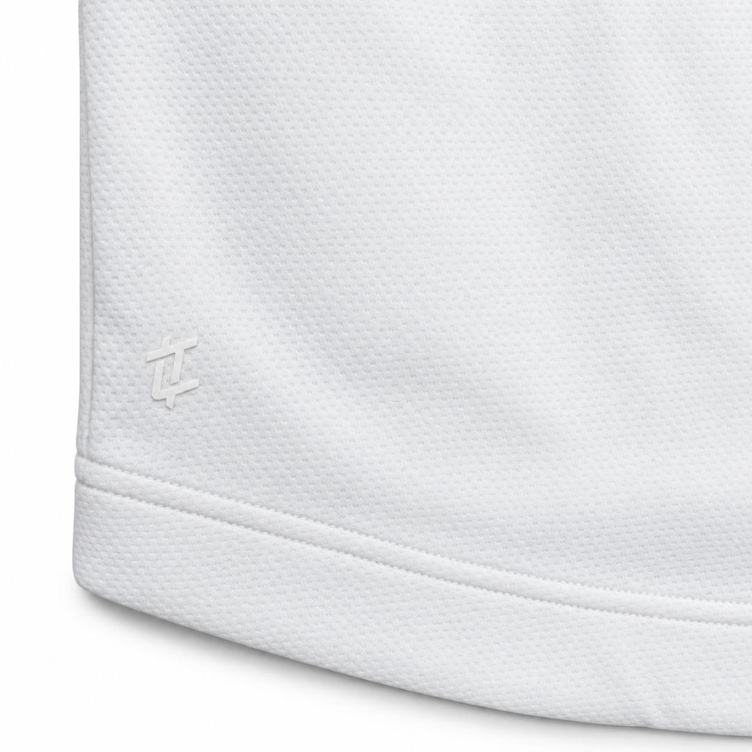 Close-up of the tonal logo and hem stitching on The Standard Crew in White